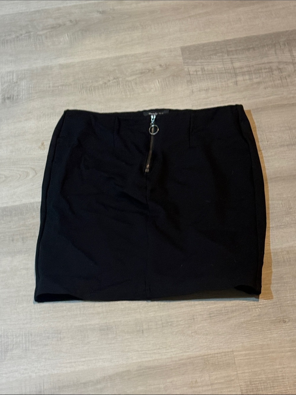 Sleek Black Pencil Mini Skirt with Front Ring Zip